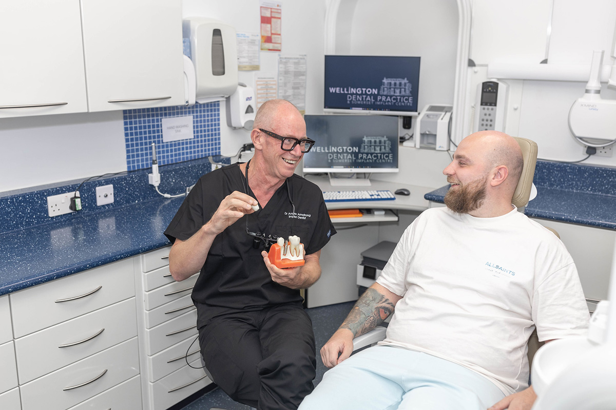 Happy patient looking in a mirror